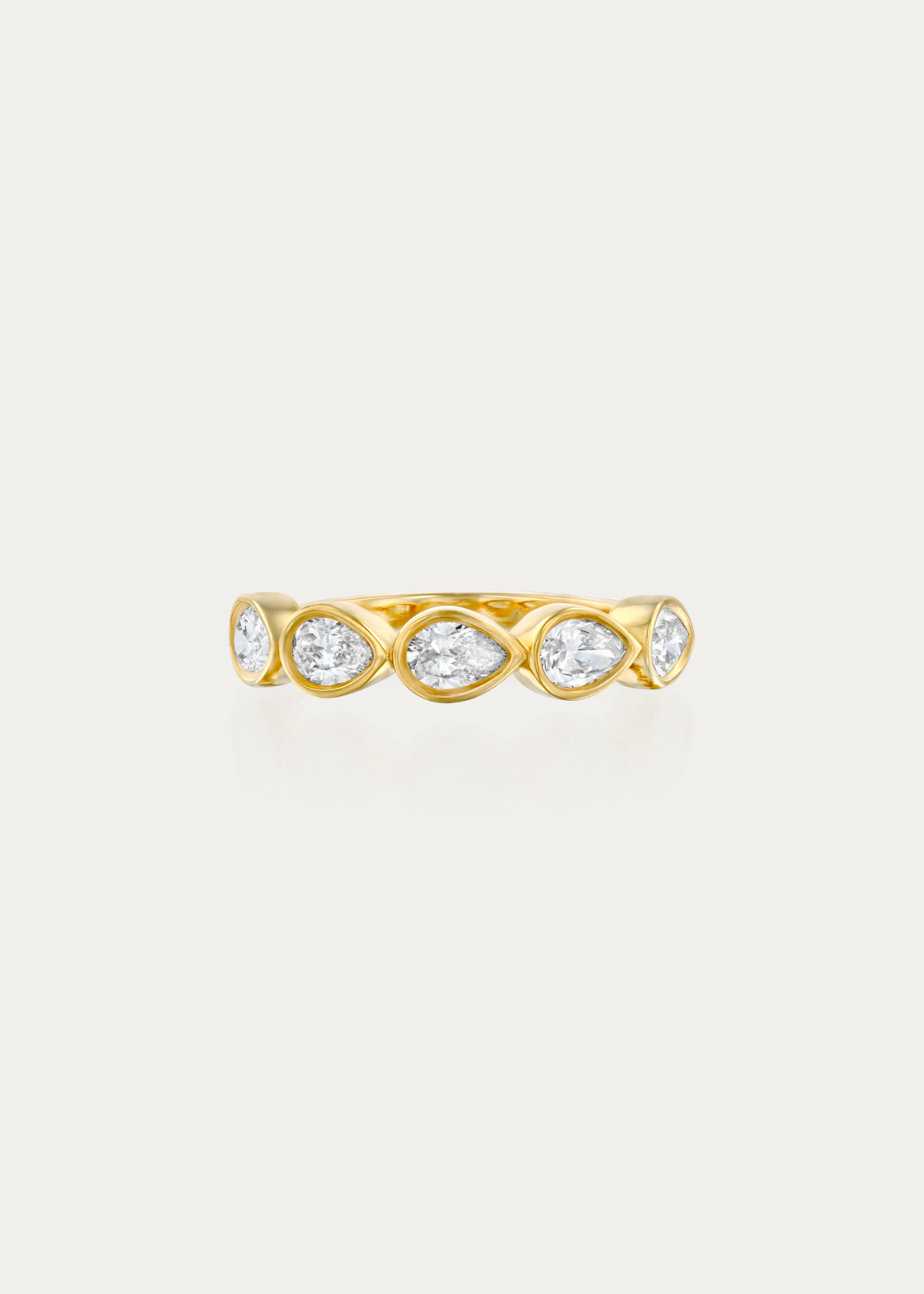 Side profile of the Clair Ring by Presiada showing the soft curves and bezel detailing. Crafted in 18K gold, set with 5 pear-cut diamonds for timeless romance.
