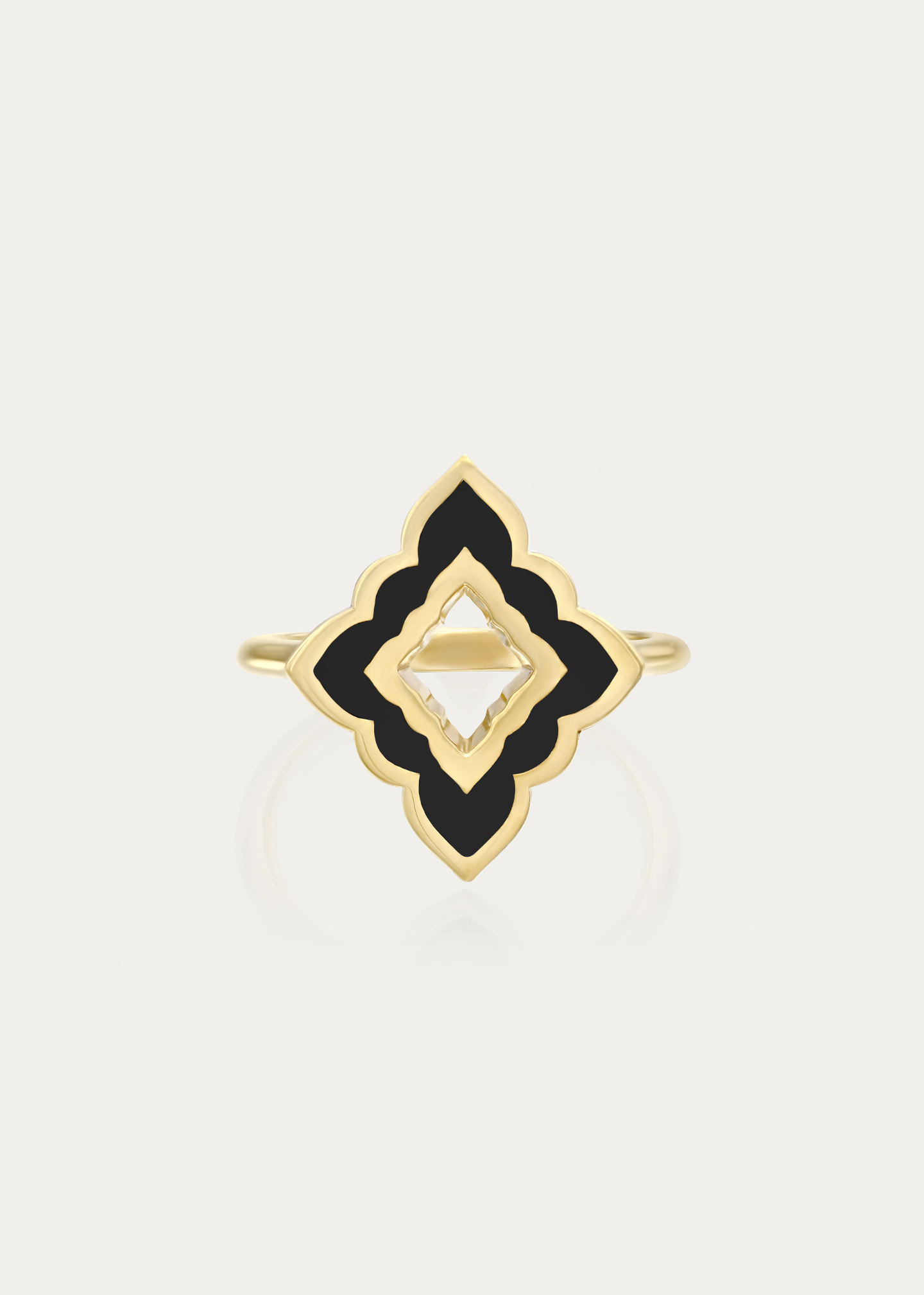 Top-down view of the Mirage Noir Ring, highlighting the intricate sculptural craftsmanship and smooth black enamel finish in luxurious gold.