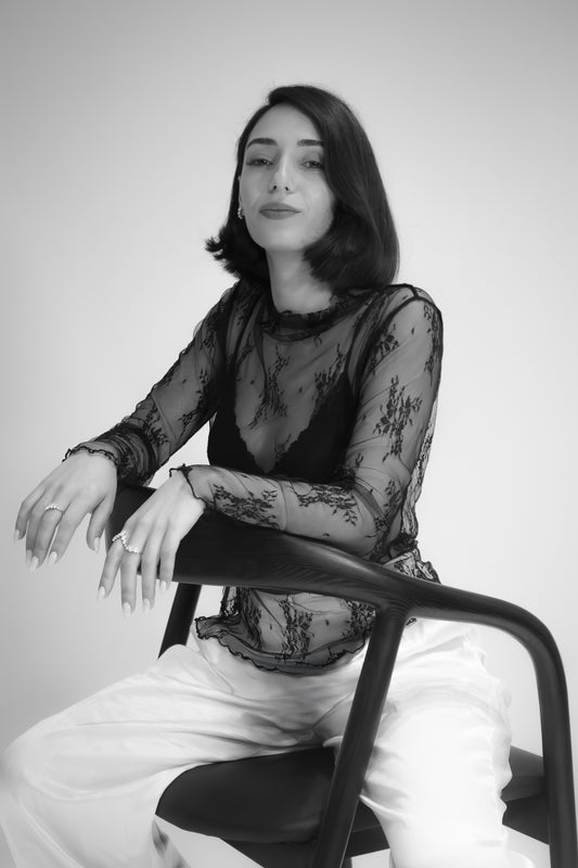Portrait of Einav Dahan, the talented designer and founder of Presiada Jewelry Studio, known for creating exquisite handcrafted luxury jewelry with timeless elegance.