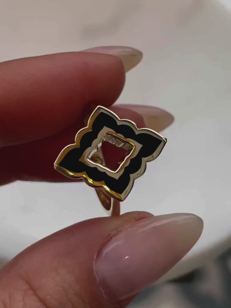 360-degree video of the Mirage Noir Ring, showcasing its sculptural design, deep black enamel, and elegant gold finish from all angles.
