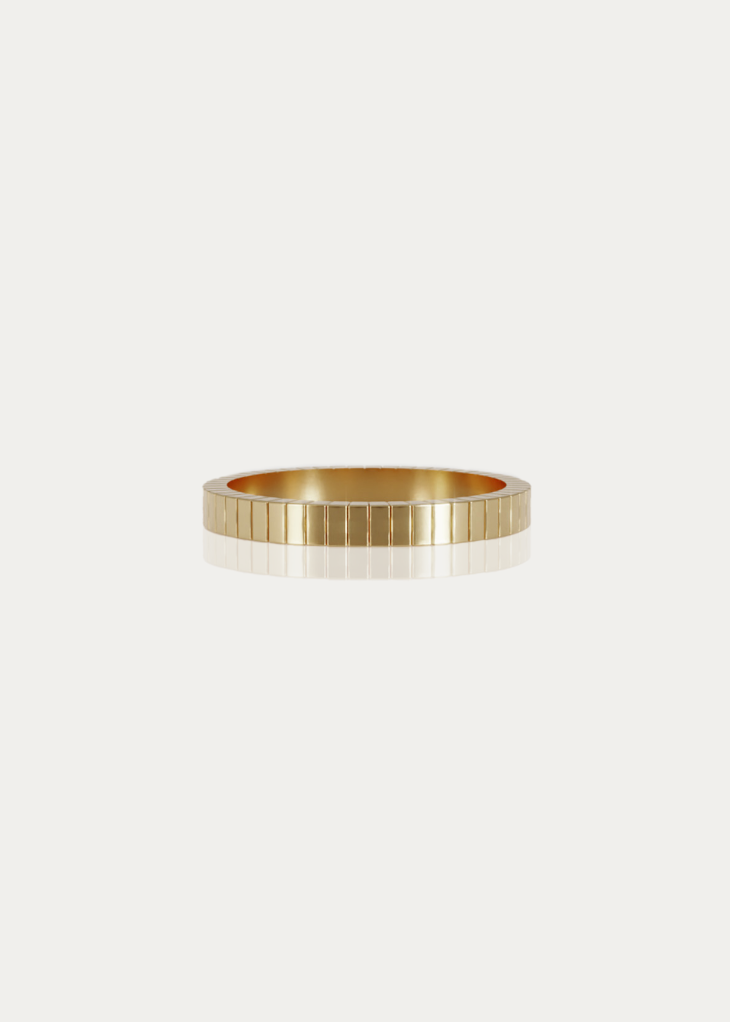 Detailed side shot of the Line Ring, showcasing its precise engraved lines and smooth finish. A bold yet refined band, crafted in solid 14K or 18K gold, designed for timeless elegance.