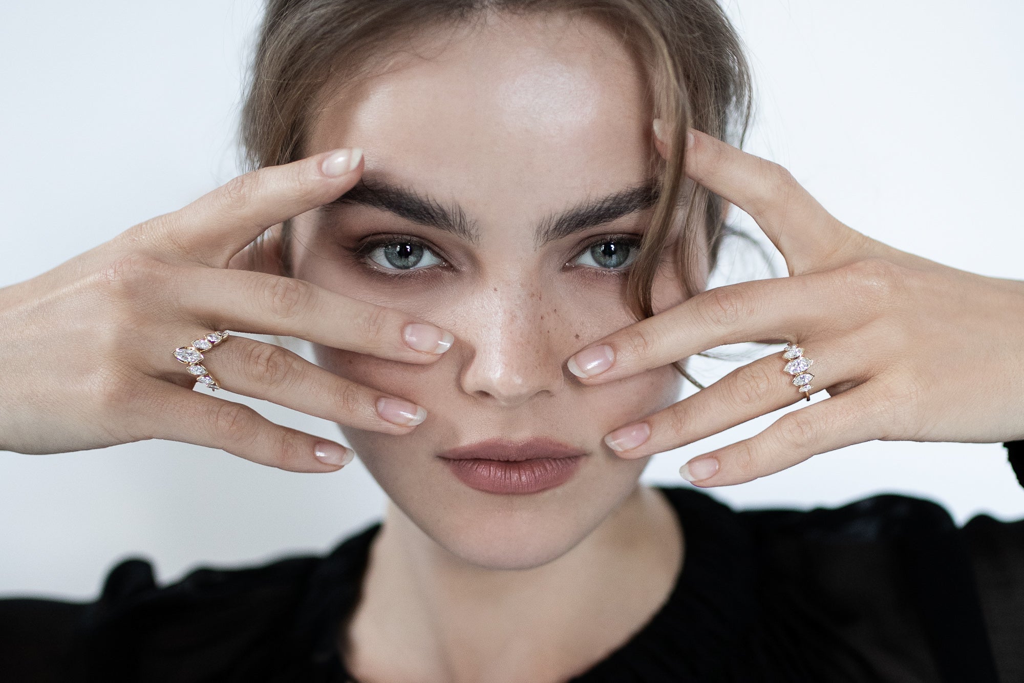 A stunning image of a model showcasing Presiada's luxurious 18K gold engagement rings, J'ador V Flam and La Divine, featuring marquise diamonds. Available in both natural and lab-grown diamond options, these elegant rings combine timeless sophistication with modern artistry, perfect for engagement or special occasions.