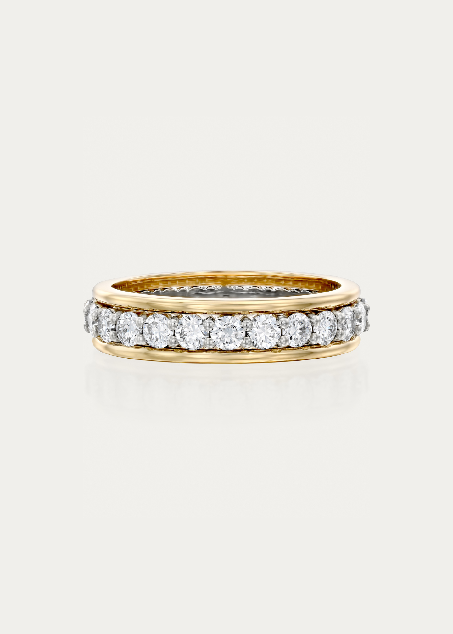 Side profile of the Framed Eternity two-tone ring showing the framed diamond setting and elegant contrast between 18K white and yellow gold.
