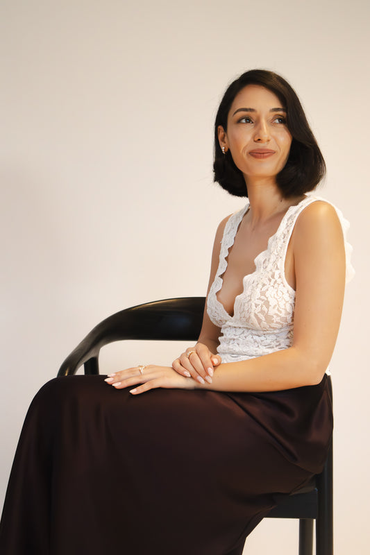 Portrait of Einav Dahan, the talented designer and founder of Presiada Jewelry Studio, known for creating exquisite handcrafted luxury jewelry with timeless elegance.